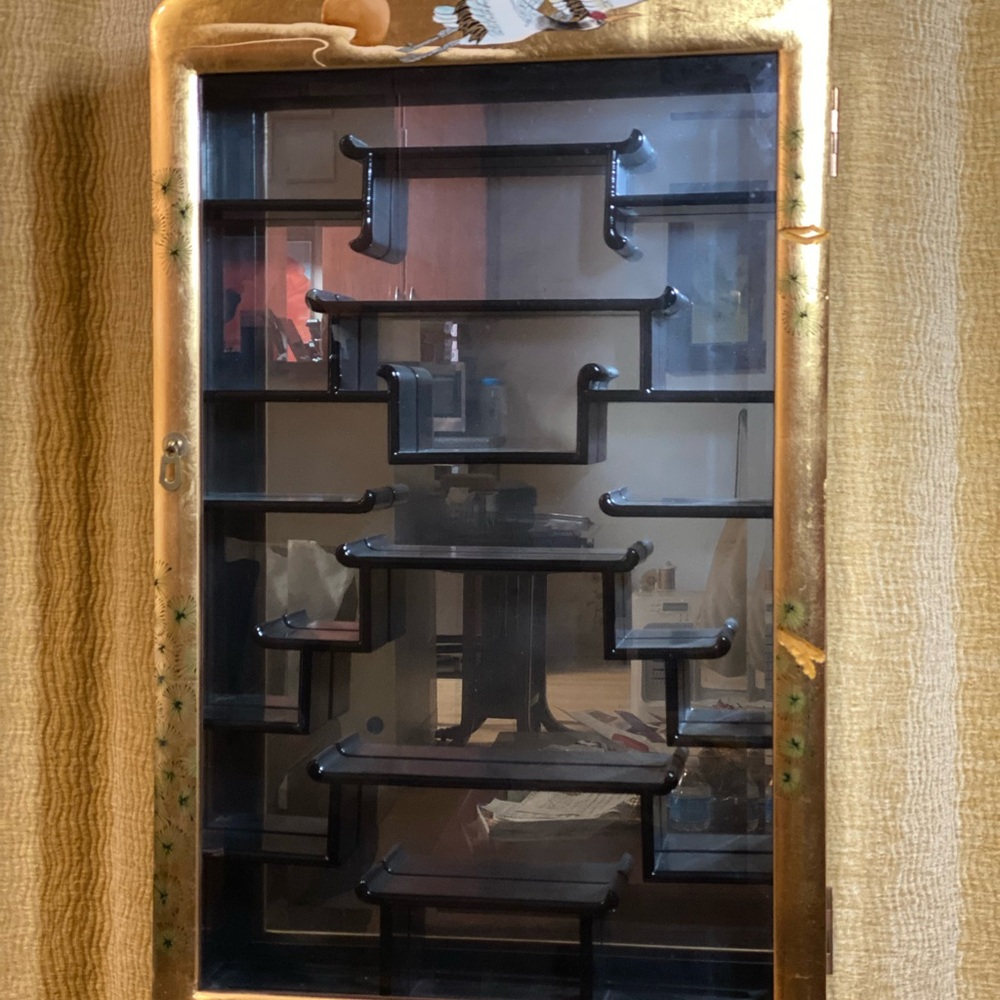 Elegant Black and Gold Wall Display Cabinet. Asian style decorated